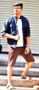 Full length portrait of young man standing outdoors