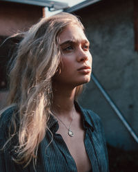 Portrait of young woman looking away