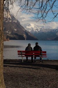 Scenic view of lake and mountains against sky