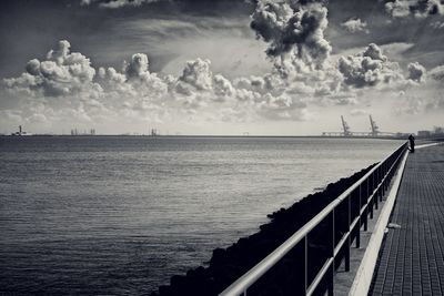 View of calm sea against cloudy sky