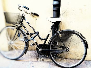 Bicycle leaning against wall