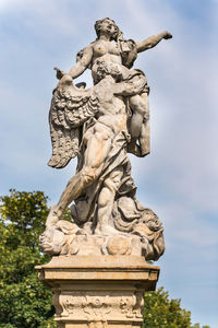 Low angle view of statue against sky