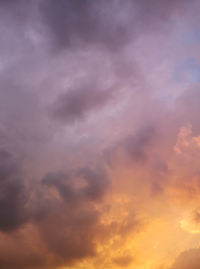 Low angle view of cloudy sky during sunset