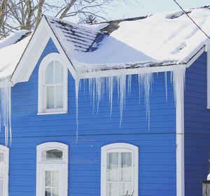 White building with snow covered roof