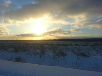 Scenic view of landscape against sky during sunset