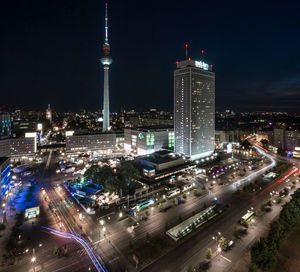 High angle view of city lit up at night