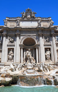 Low angle view of statues at trevi fountain