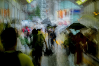 People walking on street in city