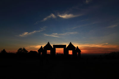 Silhouette ratu boko ruins against blue sky at dusk