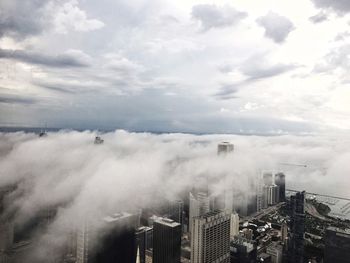 High angle view of buildings in city against sky