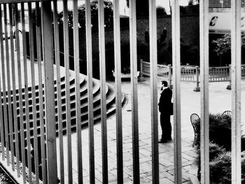 Man walking by building