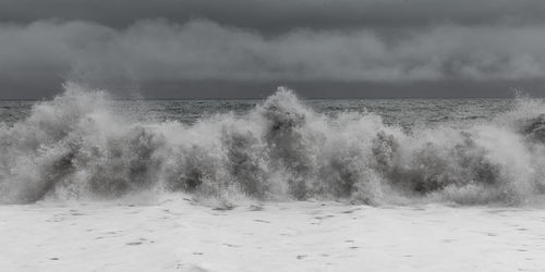 View of waves in sea against sky