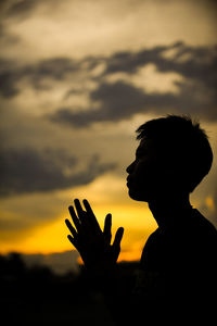 Portrait of silhouette man against sky during sunset
