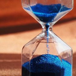 Close-up of blue glass on table