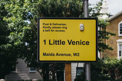 Information sign against trees