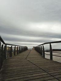 Pier over sea against sky