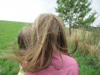 Portrait of girl in grassy field