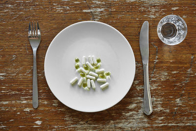 High angle view of vegetables in plate on table