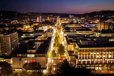 Aerial view of city lit up at night