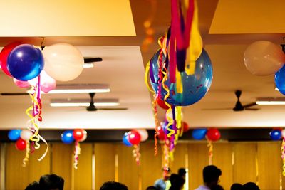 Low angle view of balloons hanging on ceiling at home