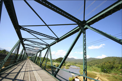 Bridge over landscape against blue sky