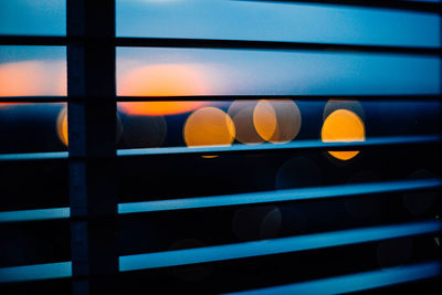 Close-up of illuminated window at sunset