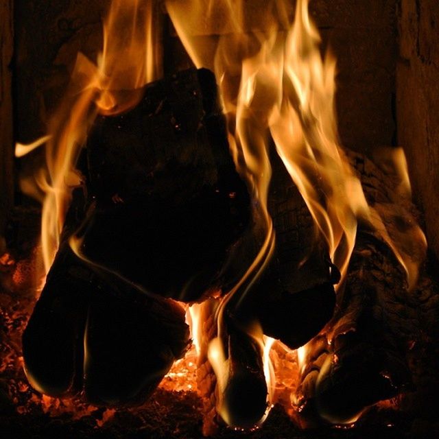 burning, flame, heat - temperature, fire - natural phenomenon, glowing, close-up, bonfire, night, indoors, fire, campfire, heat, dark, no people, firewood, motion, light - natural phenomenon, wood - material, orange color, black background