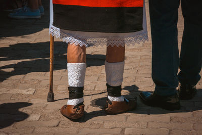 Low section of man standing on floor