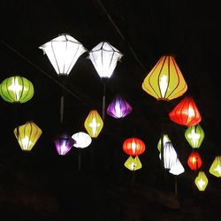 Low angle view of lanterns hanging at night