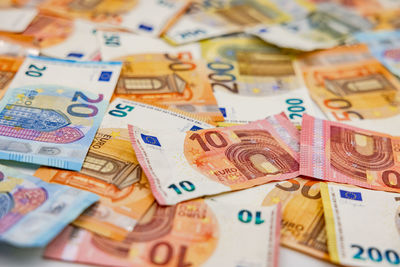 Many euro banknotes as a background with a low depth of field show richness