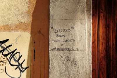 Close-up of text on wall