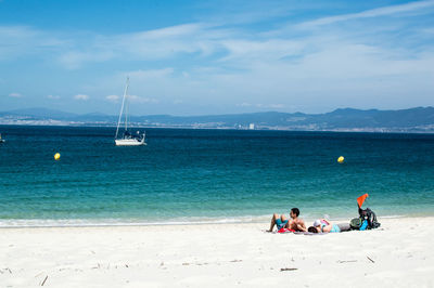 Scenic view of sea against blue sky