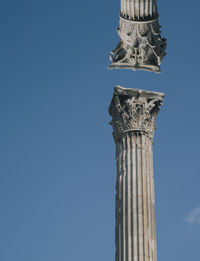 Low angle view of historical building against blue sky