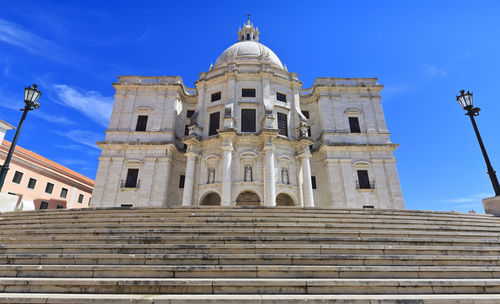 Low angle view of building against blue sky