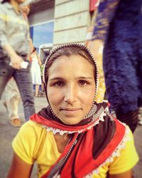 Portrait of a serious young woman outdoors