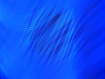 Full frame shot of illuminated blue background
