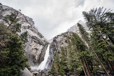 Scenic view of waterfall against sky