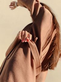 Low angle view of woman gesturing outdoors