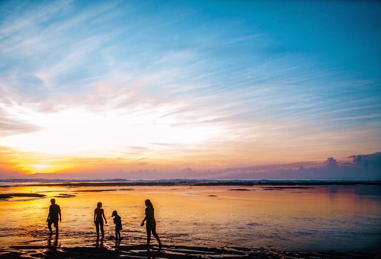 sunset, sky, nature, beauty in nature, water, scenics, silhouette, real people, beach, sea, tranquility, leisure activity, cloud - sky, outdoors, lifestyles, men, togetherness, vacations, standing, women, day, people