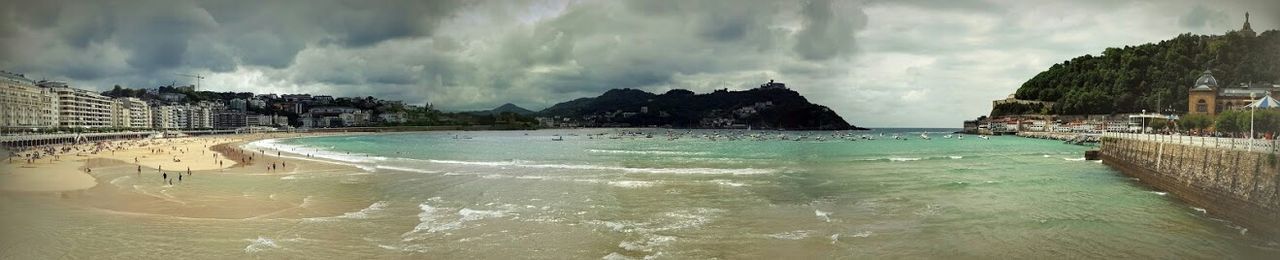 Scenic view of sea against cloudy sky