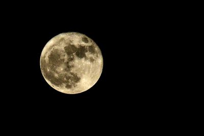 Close-up of moon against clear sky at night