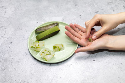 High angle view of hand with food on table