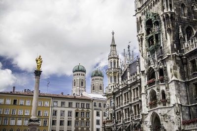 Low angle view of st marys column against sky at marienplatz