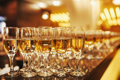 Close-up of wine glasses on table