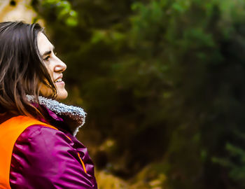 Side view of a young woman looking away