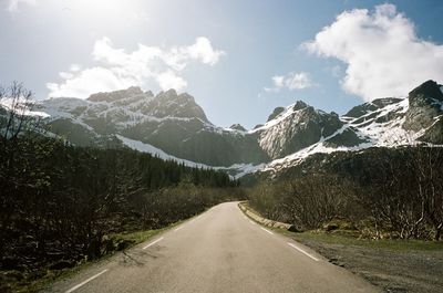 Road amidst mountains against sky