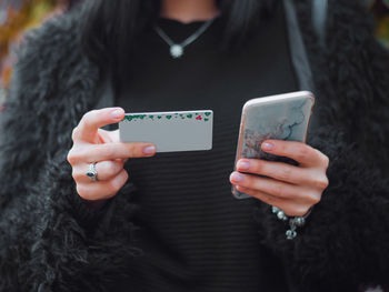 Close-up of woman using mobile phone