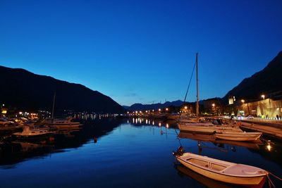 Boats in harbor at dusk