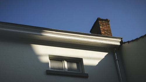 Low angle view of built structure against blue sky