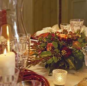 Festive table setting with a vase with a stylish bouquet of flowers. catering concept